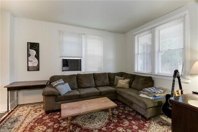 Enter from a spacious front porch to the first of 