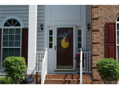 Brick stairs and covered two story entry