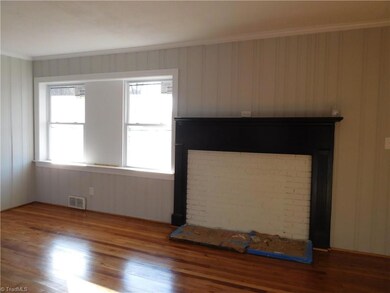 Spacious Living Room w/hardwoods. Tons of Natural Light.  Spacious Room.