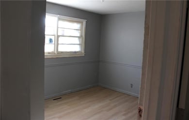 Empty room with light wood-type flooring