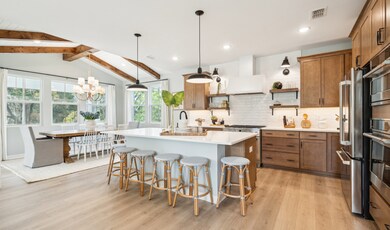 Kitchen with open shelves & pendant lighting