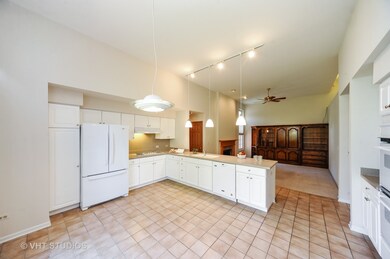 White Kitchen is open to the Family Room and has 4