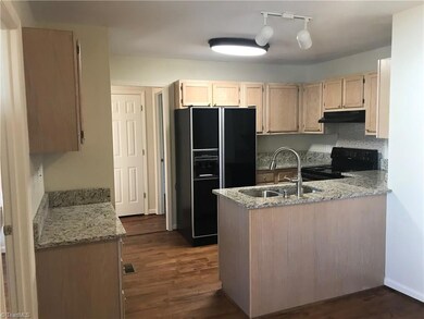 Kitchen with granite countertops and new range/oven