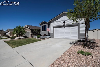 Single story home with board and batten siding, co