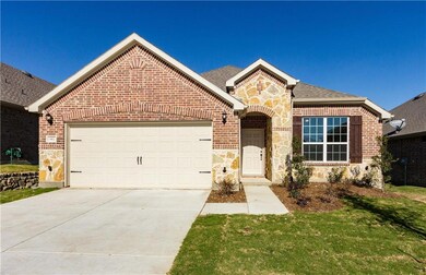 NEW CONSTRUCTION: Front of home with brick and sto