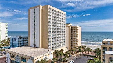 View of building exterior with a water view and a 