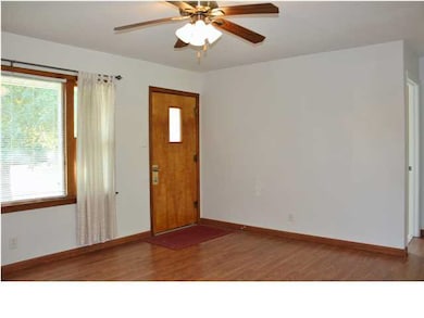The wings on the picture window and the garage are