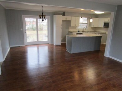 LIVING ROOM, DINING AREA AND KITCHEN