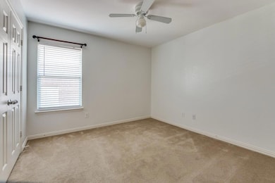 Carpeted spare room with a wealth of natural light