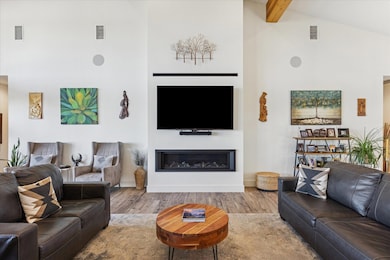 Living room featuring wood finished floors, high 