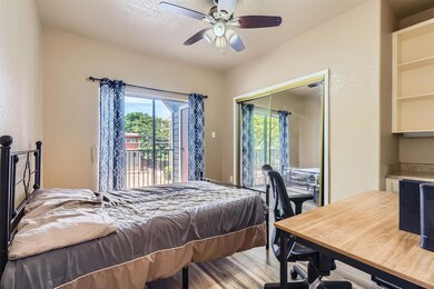 Bedroom with access to outside, wood finished flo