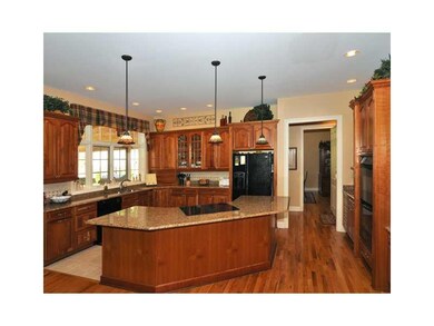 Kitchen. Kitchen cabinets are solid cherry wood in