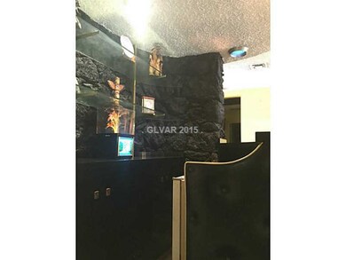 Other. Lava rock wall behind the wet bar in the fo
