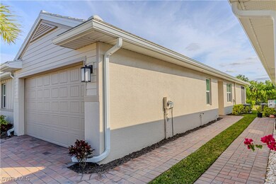 View of property exterior featuring a garage, deco