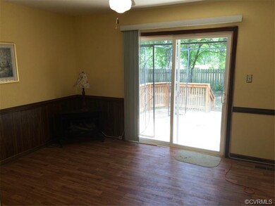 The rear family room is adjacent to the kitchen an
