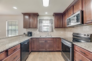 Fully renovated kitchen including cabinets, counters, backsplash and appliances.