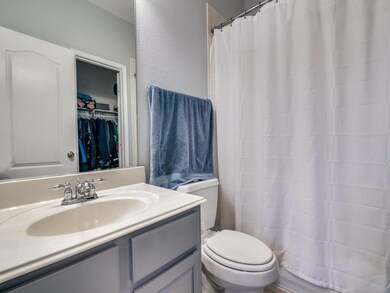 Bathroom featuring oversized vanity and toilet.  1st Floor