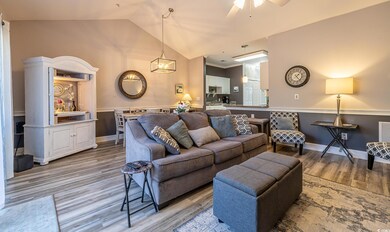 Living room with light hardwood / wood-style floor