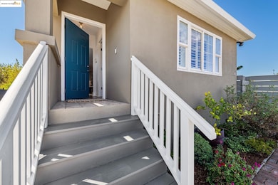 View of exterior entry featuring stucco siding