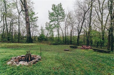 Private backyard with natural fire pit makes you feel like you aren't in a neighborhood at all