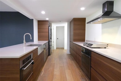 Kitchen with modern cabinets, appliances with sta