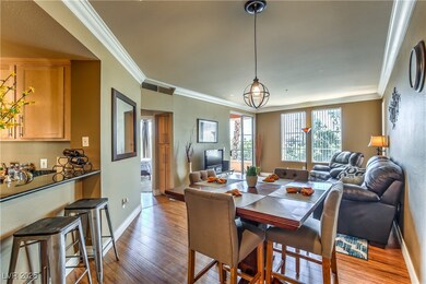 Dining area featuring wood finished floors and orn