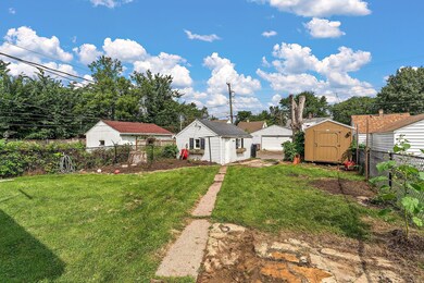 Fenced backyard with storage shed
