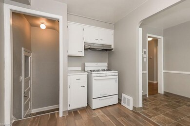 Kitchen with light countertops, white gas range, d