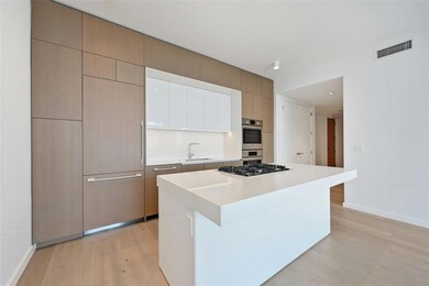 Kitchen featuring visible vents, a kitchen island