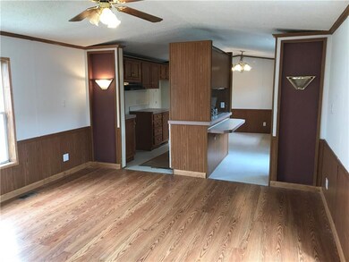 Living room looking into kitchen. Newer laminate f