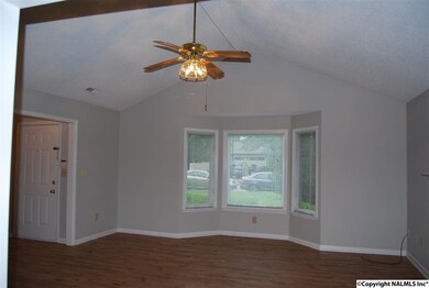 New floors, new paint, fireplace, bay window, blinds, ceiling fan with center light.