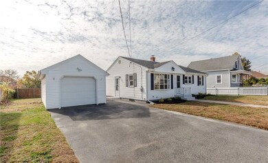 Exterior front with garage and driveway
