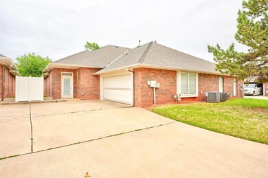 Ranch-style house featuring a front yard, a garage