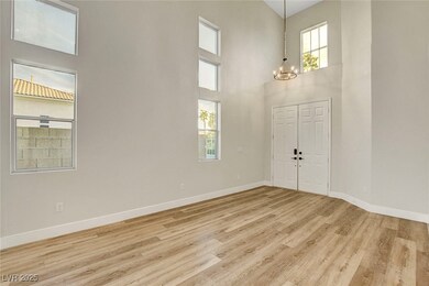 Foyer with wood finished floors, baseboards, and a