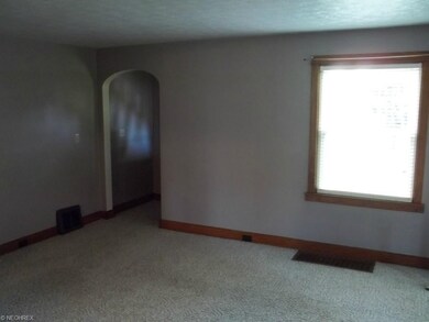Living room and front entrance.