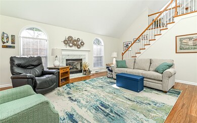 Light and bright living room with cozy gas log mar