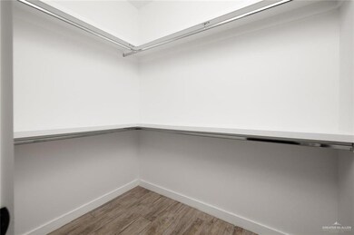 Walk in closet featuring wood finished floors