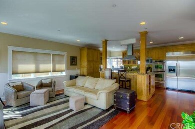 living room to kitchen.  Note kitchen bar and beau