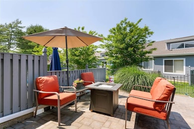 View of patio featuring an outdoor fire pit