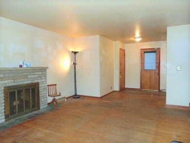 101 - Living Room w Fireplace to Dining