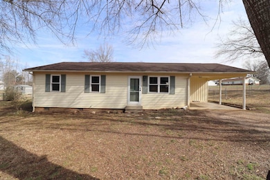 Ranch-style home with a carport