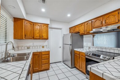 Kitchen featuring appliances with stainless steel