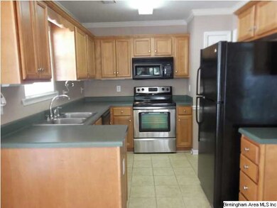 Kitchen with stainless stove and sink.