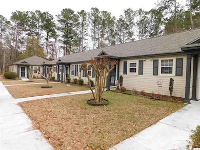 Ranch-style home with a front yard