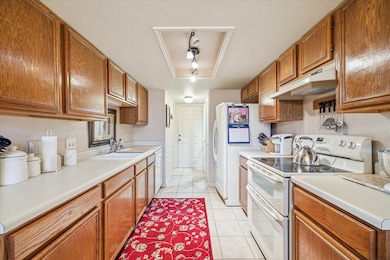 Good size kitchen with ample counters and white ap