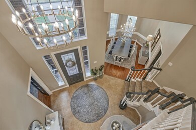 Pizzaz the moment you walk in.  Foyer features high ceilings, tiled floors and a 2 tier modern chandelier.