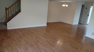 living room and view of dining room