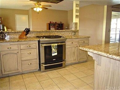 Upgraded kitchen features a stainless steel stove,