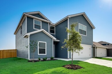 Traditional-style home with a garage and concrete driveway