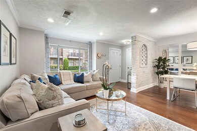 Large windows and recessed lighting create a light